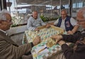 Turkish Men Playing Rummy Tile Game Near the Seaside